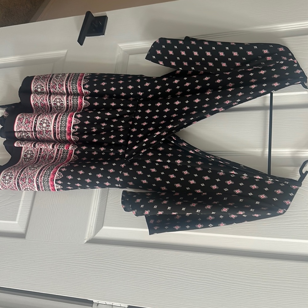 New. Never worn romper. With tags